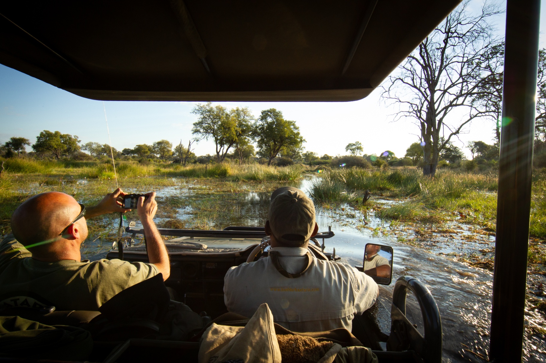 Game drive through flooded plains in the Okavango