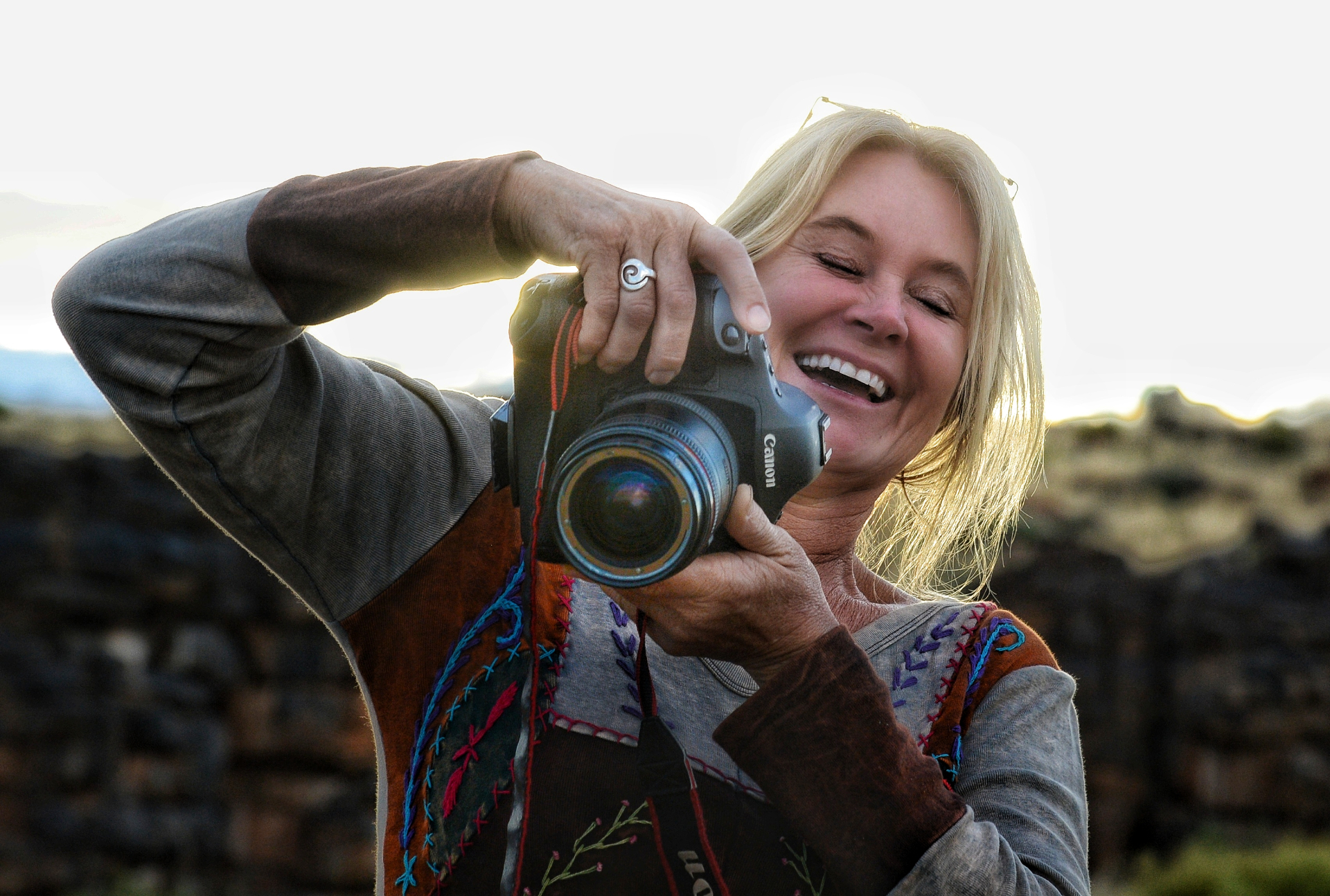 Jytte laughing behind her camera